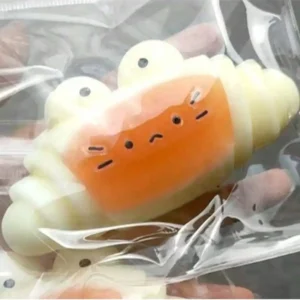 caramel croissant silicone squeezable stress relief toy banner 2