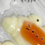 caramel croissant silicone squeezable stress relief toy banner 4