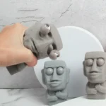 moai statue stress relief toy with funny expression banner 3